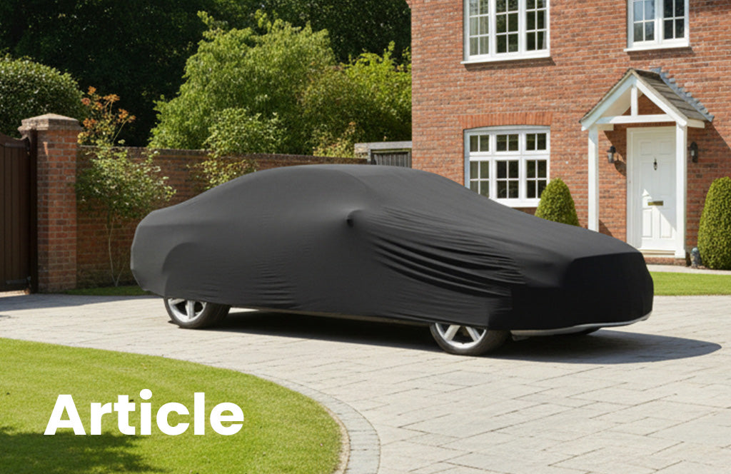 Mercedes Benz CL 500 with a black indoor car cover over the top 