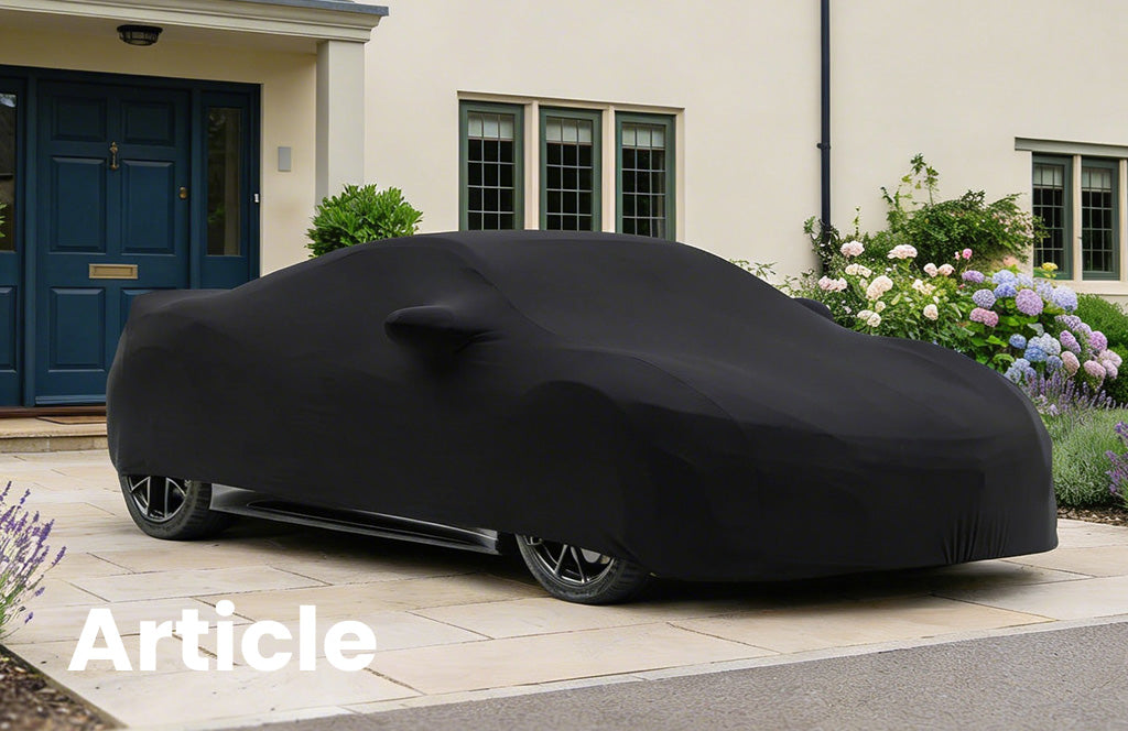 Honda NSX with a black indoor car cover over the top